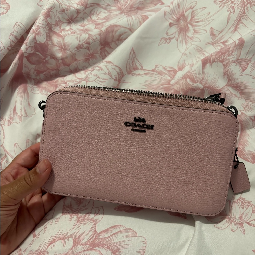 Lovely light pink coach crossbody bag with dark grey hardware. Never worn!